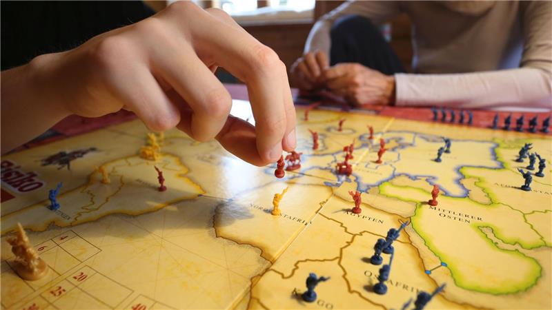 Bei Area-Control-Brettspielen versuchen die Spielenden, bestimmte Gebiete einzunehmen.