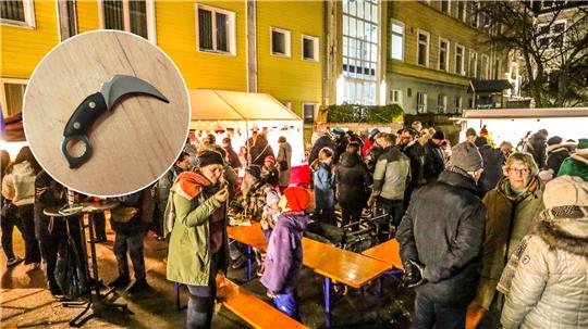 Das Bild zeigt sowohl viele Menschen auf dem Adventsmarkt im Innenhof der TU Clausthal, als auch ein sogenanntes Karambit-Messer im Miniaturformat, das mehrere Kinder mit nach Hause genommen haben.