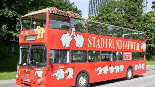 Der Ottifanten-Doppeldeckerbus kann bereits in der Stadt gesichtet werden.