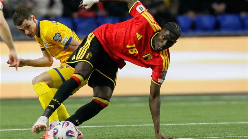 Spanien, Schweiz und Österreich ganz nah am WM-Ticket Die Belgier um Amadou Onana (r.) kamen in Kasachstan ins Stolpern.