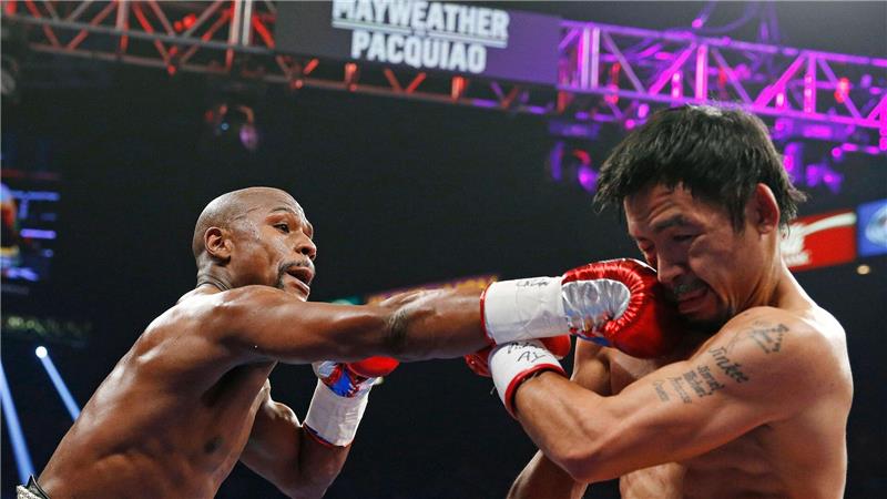 Im Juni 2015 flogen erstmals die Fäuste zwischen Floyd Mayweather (l) und Manny Pacquiao. (Archivbild)