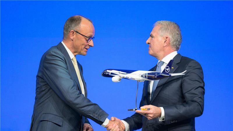 Kanzler Merz und Lufthansa-Chef Spohr.  