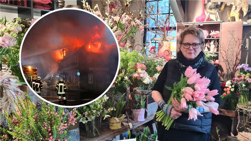 Eine Frau mit Brille hält einen dicken Strauß mit rosa Tulpen im Arm, um sie herum zahlreiche Blumen in einem Blumengeschäft.