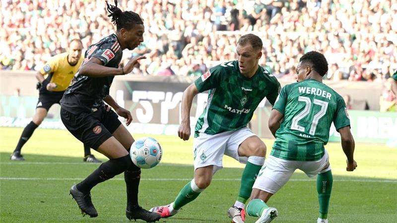 Nächste Tor-Gala: Bayern ungeschlagen aufs Oktoberfest Michael Olise (l) brachte Bayern München früh in Führung.