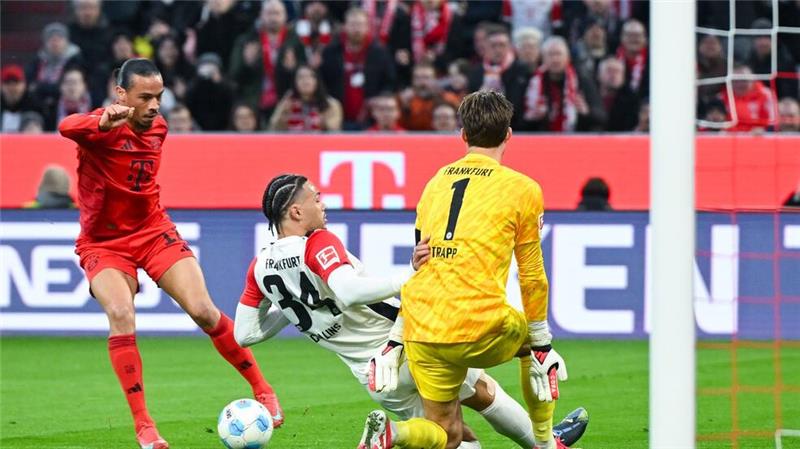 Bayern bleiben auf Meisterkurs und sorgen sich um Kimmich Oft in Aktion: Leroy Sané (l), rechts Frankfurts Torwart Kevin Trapp.
