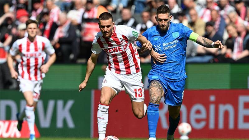 Rivalen am Rhein: Kölns Said El Mala (l) und Robert Andrich von Bayer Leverkusen.