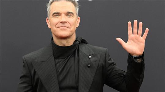 Robbie Williams hat als neuer Musikbotschafter der Fifa eine neue Hymne für den Weltfußballverband komponiert. (Archivfoto)