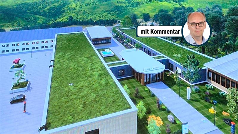 Luftaufnahme eines modernen Gebäudekomplexes mit begrünten Flachdächern und umliegendem Wald.