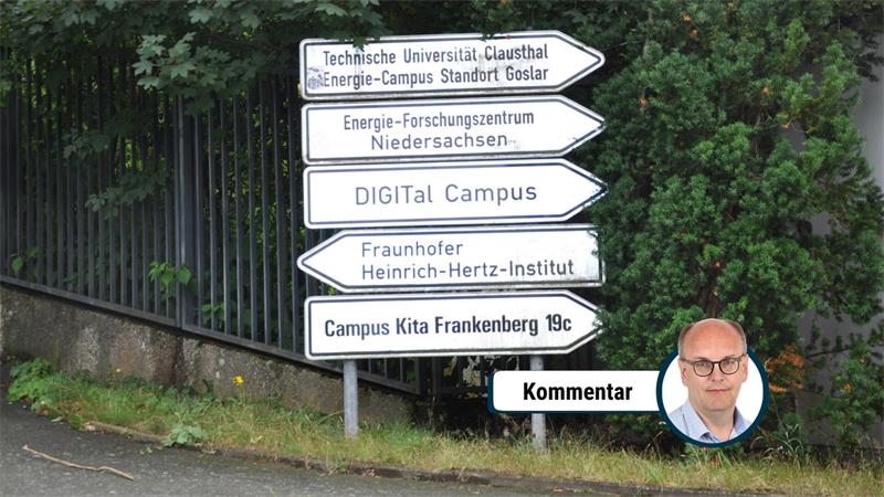 Wegweiser mit fünf Schildern vor grünem Gebüsch, die zu verschiedenen Einrichtungen wie Technische Universität Clausthal, Energie-Forschungszentrum Niedersachsen, DIGITa Campus, Fraunhofer Heinrich-Hertz-Institut und Campus Kita Frankenberg 19c führen